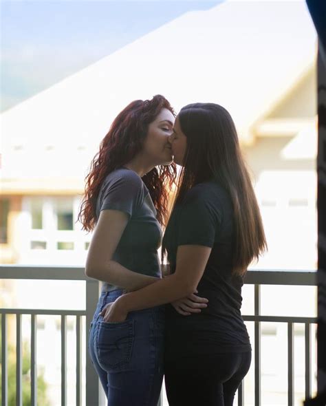 girls kissing in the bed|two attractive lesbian girlfriends passionately kissing and。